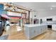 Open floor plan combining the kitchen with a cozy living area, complete with fireplace and loft at 4414 E Baltimore Ave, Las Vegas, NV 89104