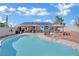 Relaxing backyard pool with tanning deck and a gazebo with hot tub and outdoor kitchen at 4414 E Baltimore Ave, Las Vegas, NV 89104