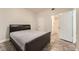 Bedroom featuring tile floors and a view into an adjacent bathroom at 5162 S Jones Blvd # 108, Las Vegas, NV 89118