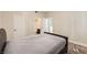 This bedroom features marble-look floors and a convenient ensuite bathroom for added privacy at 5162 S Jones Blvd # 108, Las Vegas, NV 89118