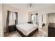 Bright bedroom with a ceiling fan and sliding mirrored closet doors at 5162 S Jones Blvd # 108, Las Vegas, NV 89118