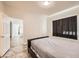 Comfortable bedroom with neutral walls, complemented by tile floors and a large window with privacy blinds at 5162 S Jones Blvd # 108, Las Vegas, NV 89118