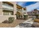Exterior of building shows landscaped ground, stairs lead up to units above the ground floor at 5162 S Jones Blvd # 108, Las Vegas, NV 89118
