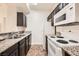 Functional kitchen with granite countertops, ample cabinet space, and white appliances at 5162 S Jones Blvd # 108, Las Vegas, NV 89118