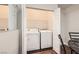 This laundry area features a stacked washer and dryer, complemented by a modern counter and storage at 5162 S Jones Blvd # 108, Las Vegas, NV 89118