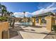 Resort-style pool area with covered seating, mature palm trees, and lush landscaping at 5162 S Jones Blvd # 108, Las Vegas, NV 89118