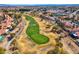 A lush golf course view in a residential community with a golf cart at 5305 La Patera Ln, Las Vegas, NV 89149