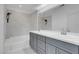 Bathroom featuring double sink vanity and tub shower combo at 5305 La Patera Ln, Las Vegas, NV 89149