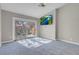 Bedroom featuring vaulted ceilings, carpet, tv and access to a private balcony at 5305 La Patera Ln, Las Vegas, NV 89149