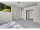 Spacious carpeted bedroom featuring an ensuite bathroom and multiple closets at 5305 La Patera Ln, Las Vegas, NV 89149