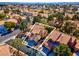 Inviting home with tile roof, mature trees, and a two-car driveway in a golf course community at 5305 La Patera Ln, Las Vegas, NV 89149