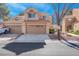 Inviting townhome with a two-car garage and classic desert landscaping at 5305 La Patera Ln, Las Vegas, NV 89149