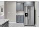 Kitchen features a stainless steel refrigerator, gray cabinets, and light countertops at 5305 La Patera Ln, Las Vegas, NV 89149