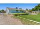 Back exterior showcasing the large yard and patio area, perfect for outdoor entertaining at 5350 Topaz St, Las Vegas, NV 89120