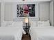 Bright bedroom features two twin beds with matching headboards and a large London print at 5350 Topaz St, Las Vegas, NV 89120