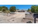 Gated property featuring a circular driveway and mature trees at 5350 Topaz St, Las Vegas, NV 89120