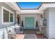 Inviting front porch with double doors, stylish lighting, and seating at 5350 Topaz St, Las Vegas, NV 89120