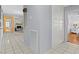 Hallway with tile floors and white trim with doors to other rooms in the home at 5350 Topaz St, Las Vegas, NV 89120