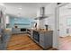 View of the stainless appliances, butcher block counters, and gray cabinets in this home's open kitchen at 5350 Topaz St, Las Vegas, NV 89120