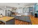 Bright kitchen featuring gray cabinetry, butcher block countertops, and stainless steel appliances at 5350 Topaz St, Las Vegas, NV 89120