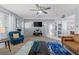 Bright living area featuring a modern ceiling fan, comfortable sofa, and an open layout at 5350 Topaz St, Las Vegas, NV 89120
