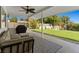 Spacious covered patio with seating area overlooking a beautifully landscaped yard at 5350 Topaz St, Las Vegas, NV 89120