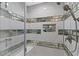 Close-up of the glass shower with white tiling and accents at 5350 Topaz St, Las Vegas, NV 89120