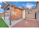 Backyard patio featuring a covered seating area and a large storage shed at 585 Jackson Dr, Henderson, NV 89014