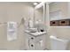 Bright bathroom features a vessel sink, updated vanity, and stylish tile backsplash at 585 Jackson Dr, Henderson, NV 89014