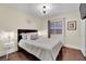 Cozy bedroom with comfortable bed, side tables, and natural lighting at 585 Jackson Dr, Henderson, NV 89014