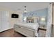 Well-lit bedroom boasts a queen bed, modern lighting, and ample natural light at 585 Jackson Dr, Henderson, NV 89014