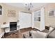 Cozy bedroom featuring a chandelier, a work space, and a closet with sliding doors at 585 Jackson Dr, Henderson, NV 89014