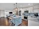 Open kitchen design with a center island featuring barstool seating and stainless steel appliances at 585 Jackson Dr, Henderson, NV 89014