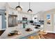 Beautiful kitchen with a large island featuring barstool seating, stainless steel appliances, and white cabinetry at 585 Jackson Dr, Henderson, NV 89014