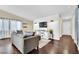 Bright living room features wood floors, neutral walls, and modern decor at 585 Jackson Dr, Henderson, NV 89014