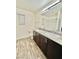 Bathroom featuring double sink vanity with granite countertop and modern fixtures at 6840 Sunflower Fields St, North Las Vegas, NV 89086