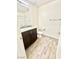 Bathroom showcasing granite countertops, vanity with brown cabinets, and tiled shower at 6840 Sunflower Fields St, North Las Vegas, NV 89086