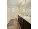 Contemporary bathroom features double sinks, granite countertop, and ample counter space at 6840 Sunflower Fields St, North Las Vegas, NV 89086