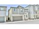 Charming two-story home with neutral colors, attached garage, and manicured landscaping at 6840 Sunflower Fields St, North Las Vegas, NV 89086