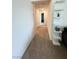 Bright hallway with neutral carpet and white walls, offering access to various rooms at 6840 Sunflower Fields St, North Las Vegas, NV 89086