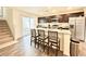 Contemporary kitchen with stainless steel appliances, granite countertops, and a breakfast bar at 6840 Sunflower Fields St, North Las Vegas, NV 89086