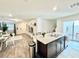 Modern kitchen features a granite island, stainless steel appliances and an open floor plan at 6840 Sunflower Fields St, North Las Vegas, NV 89086