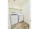 Functional laundry room featuring a modern washer and dryer set for convenient chores at 6840 Sunflower Fields St, North Las Vegas, NV 89086
