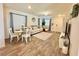 Inviting living room with hardwood floors, ample lighting, and modern furnishings at 6840 Sunflower Fields St, North Las Vegas, NV 89086