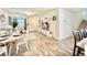 Bright and airy living room with hardwood floors, open floor plan, and modern decor at 6840 Sunflower Fields St, North Las Vegas, NV 89086
