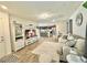 Spacious living room with a fireplace, hardwood floors, and an open concept design at 6840 Sunflower Fields St, North Las Vegas, NV 89086