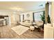 Cozy living room with hardwood floors, neutral decor, and plenty of natural light at 6840 Sunflower Fields St, North Las Vegas, NV 89086