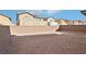 This backyard features a block wall perimeter and room for customization with landscaping and a pool at 6844 Bayou Hollow Ave, Las Vegas, NV 89156