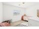 Cozy bedroom with carpet, one window, and a soft chair next to the bed at 6844 Bayou Hollow Ave, Las Vegas, NV 89156