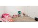 Carpeted bedroom with white walls; features a sliding-door closet and colorful decorations at 6844 Bayou Hollow Ave, Las Vegas, NV 89156